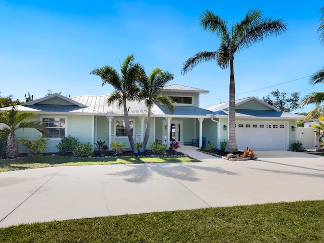 view of front of property with a porch and a garage