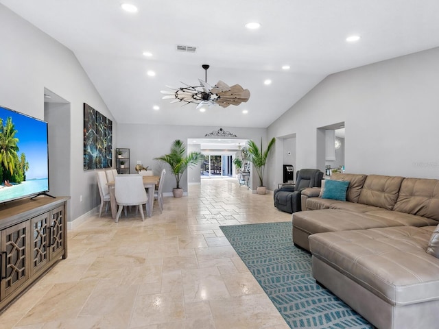 living room with ceiling fan and vaulted ceiling