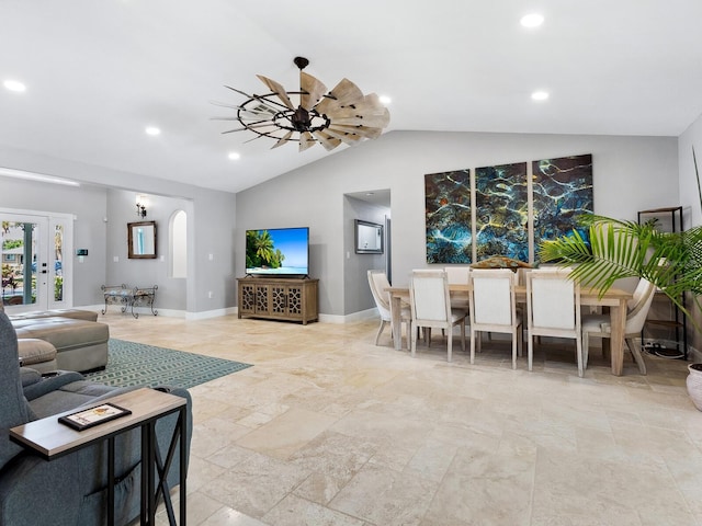 living room featuring ceiling fan and lofted ceiling