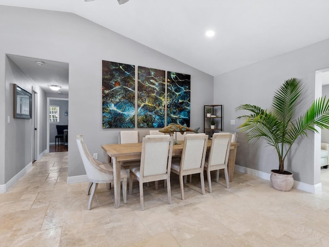 dining room with vaulted ceiling