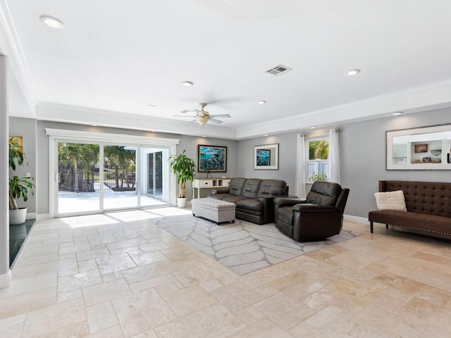 living room with crown molding and ceiling fan