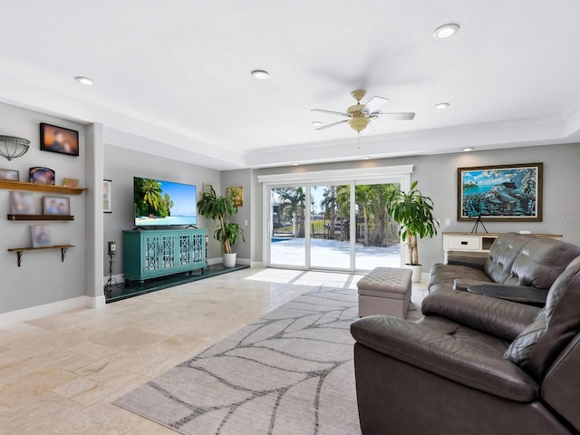 living room with crown molding and ceiling fan