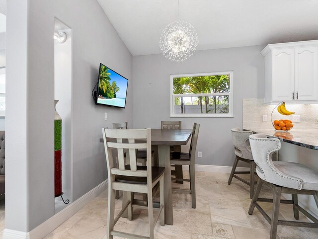dining area with a notable chandelier