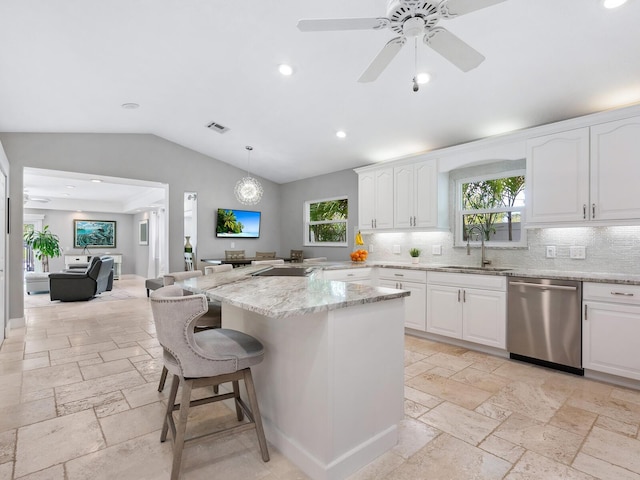 kitchen featuring white cabinetry, stainless steel dishwasher, and sink