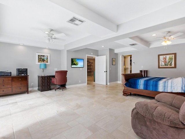 bedroom featuring a tray ceiling and ceiling fan