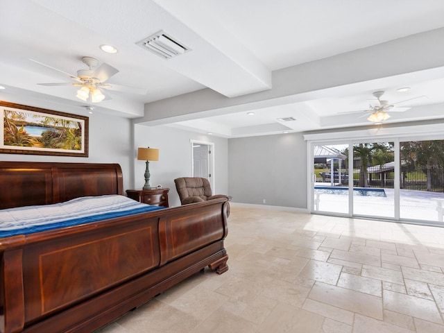 bedroom featuring ceiling fan, a raised ceiling, and access to outside