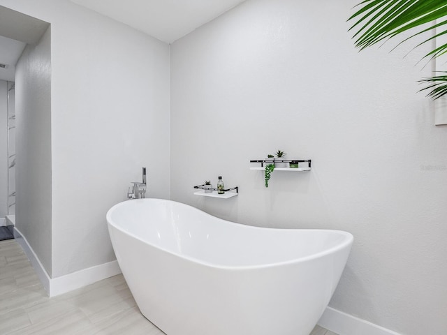 bathroom featuring a washtub