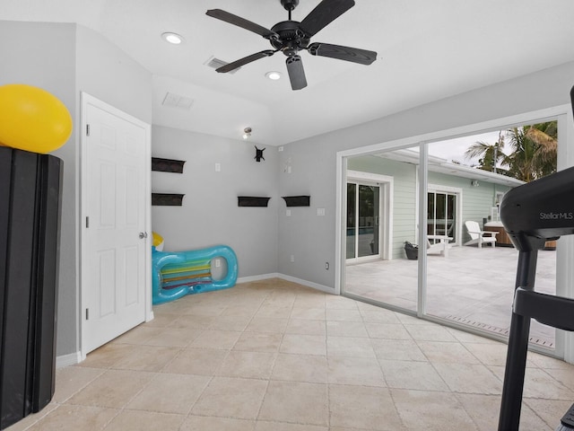 tiled bedroom with access to outside and ceiling fan