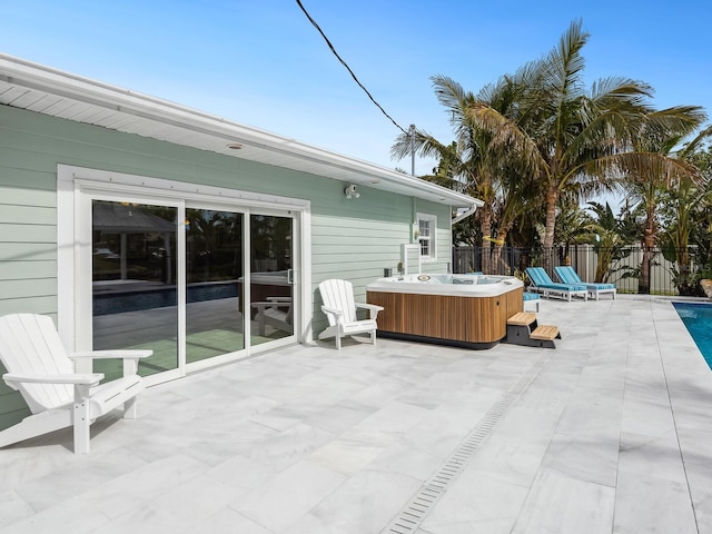 view of patio / terrace with a hot tub
