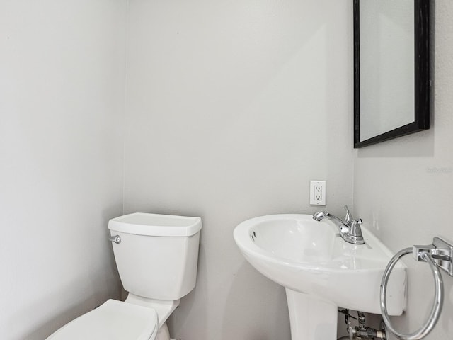 bathroom with toilet and sink