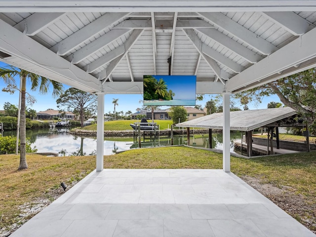 view of patio / terrace featuring a water view and a dock