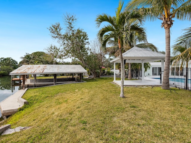 view of yard with a gazebo and a water view