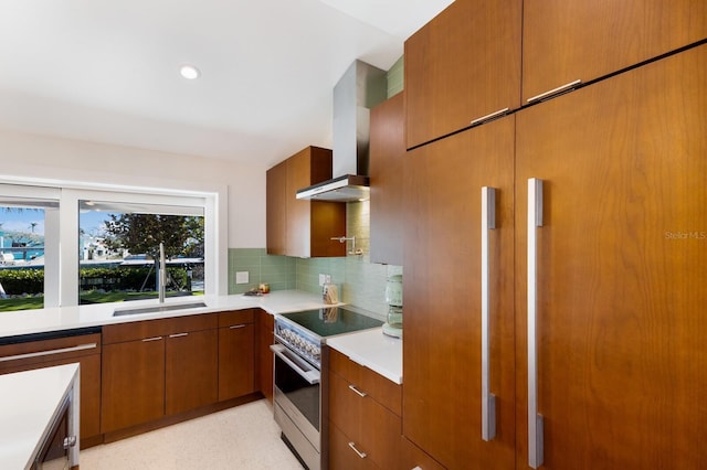 kitchen featuring sink, stainless steel electric range oven, dishwashing machine, wall chimney range hood, and backsplash