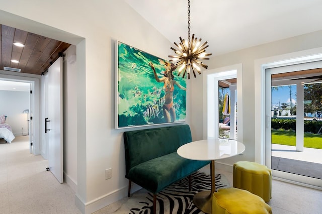 dining room with lofted ceiling and a chandelier