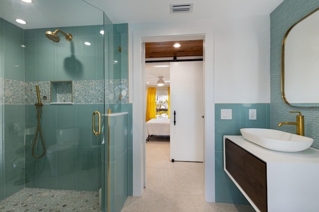 bathroom with vanity and walk in shower