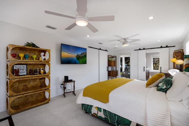 bedroom featuring ceiling fan, a barn door, and access to outside