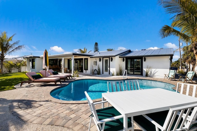 view of pool featuring a patio area