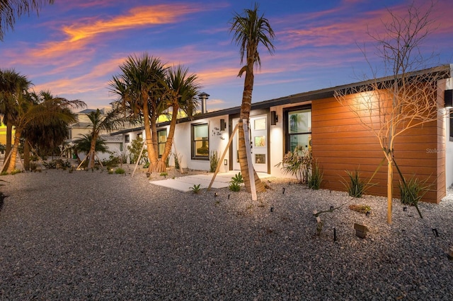 ranch-style house featuring a patio