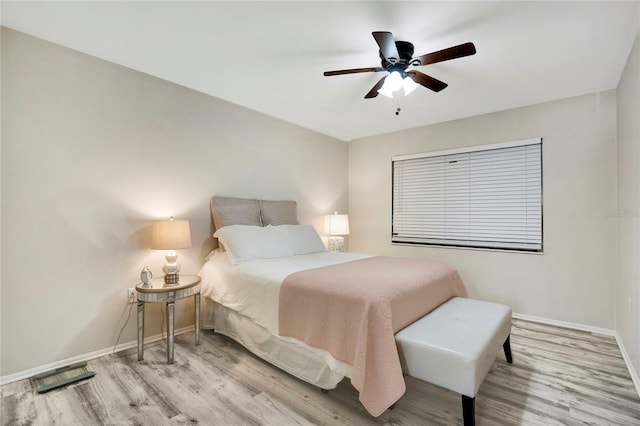 2211 Sunset Dr Unit E3, Bradenton, FL 34207 - bedroom with ceiling fan and light wood-type flooring