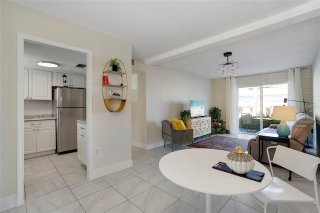 2211 Sunset Dr Unit E3, Bradenton, FL 34207 - tiled living room featuring beamed ceiling