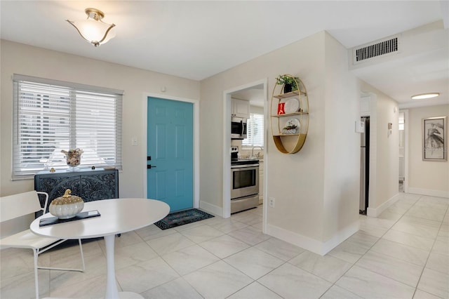 2211 Sunset Dr Unit E3, Bradenton, FL 34207 - entryway featuring light tile patterned floors