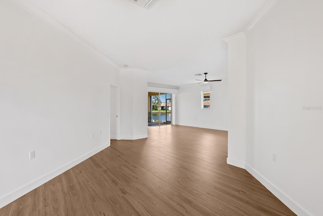 unfurnished living room featuring ceiling fan, ornamental molding, and hardwood / wood-style floors