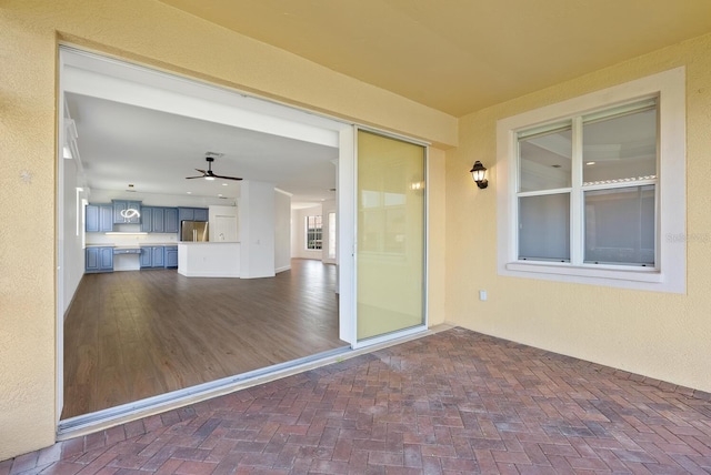 view of patio with ceiling fan