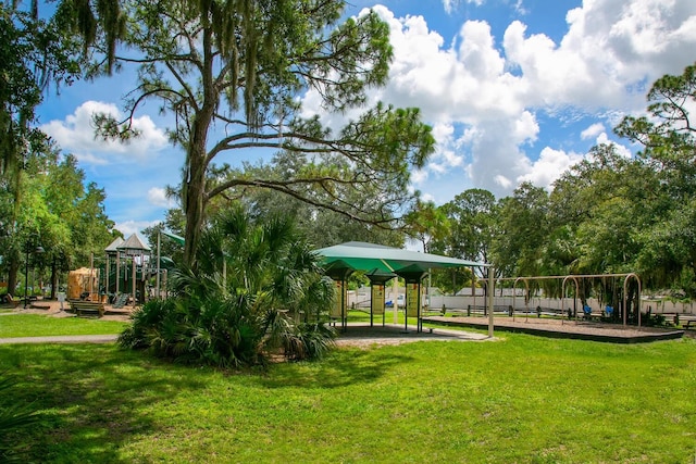 view of community with a yard and a playground