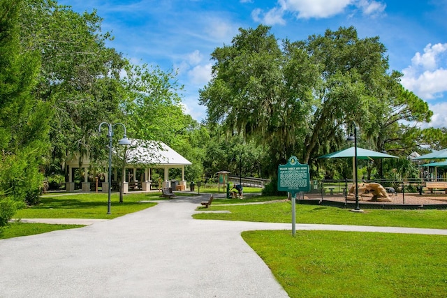 surrounding community featuring a gazebo and a lawn