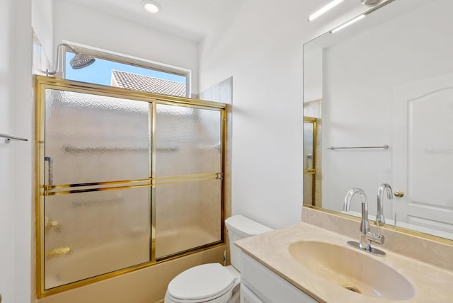 bathroom with toilet, combined bath / shower with glass door, vanity, and recessed lighting