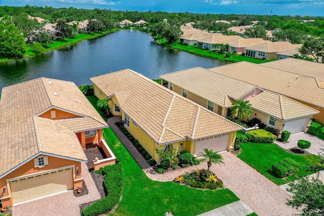 bird's eye view with a water view and a residential view