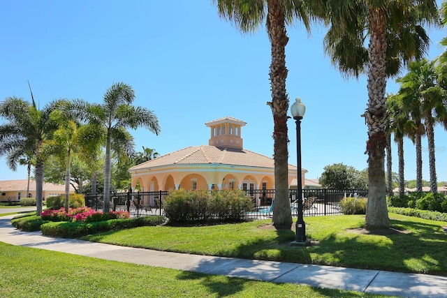 surrounding community featuring fence and a lawn