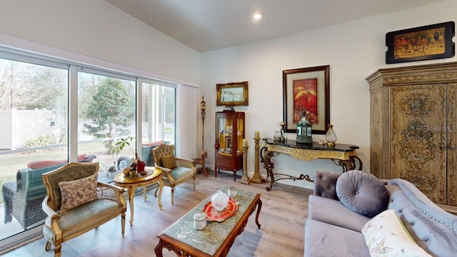 sitting room with light wood-type flooring and recessed lighting