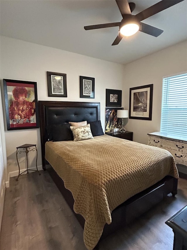 bedroom featuring ceiling fan and dark hardwood / wood-style flooring