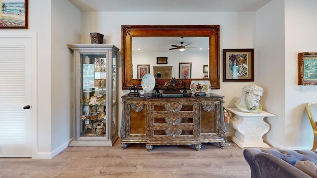 bar with light wood-type flooring and baseboards