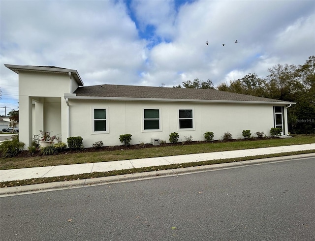 view of property exterior featuring a yard