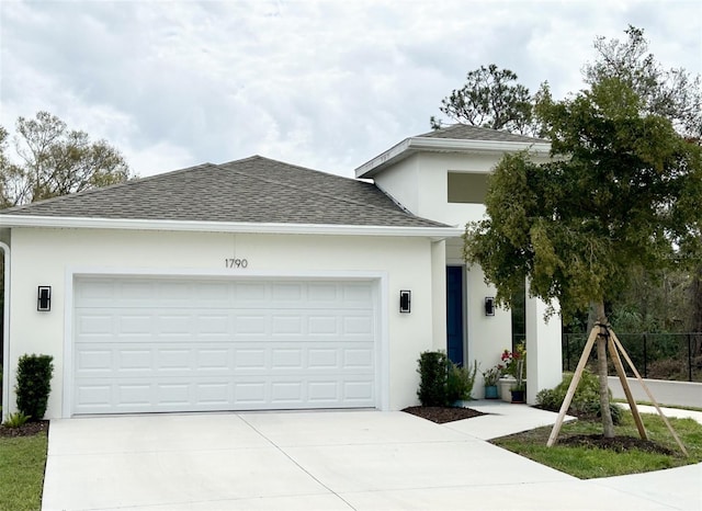 single story home with an attached garage, driveway, roof with shingles, and stucco siding