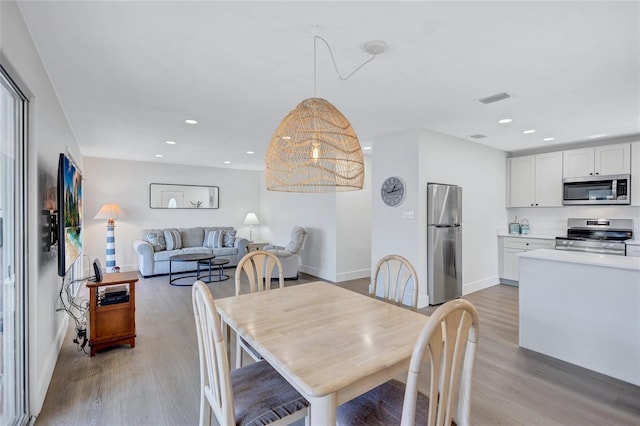 dining room with light hardwood / wood-style floors