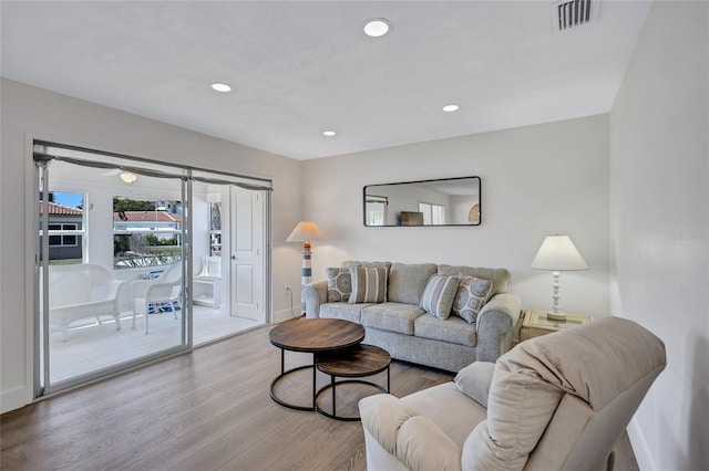 living room with light hardwood / wood-style flooring