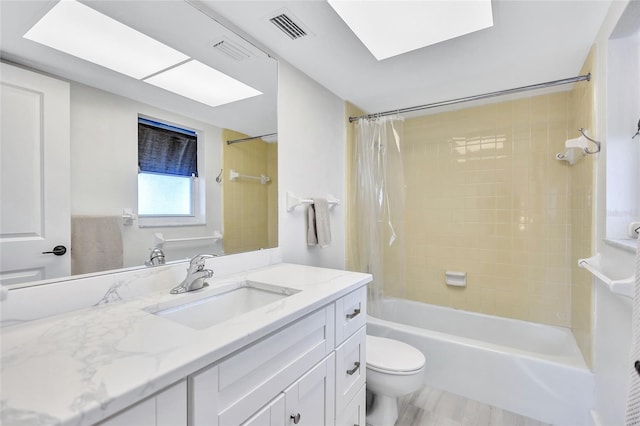 full bathroom featuring vanity, toilet, and shower / tub combo with curtain