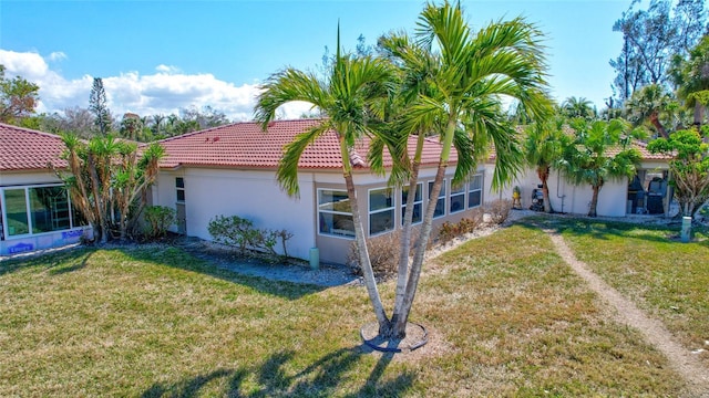 rear view of house with a lawn