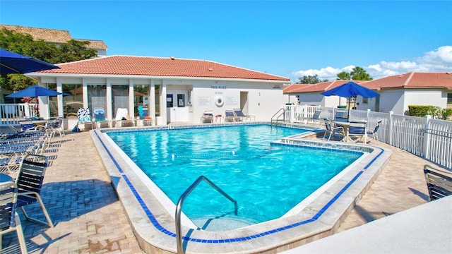 view of swimming pool with a patio area