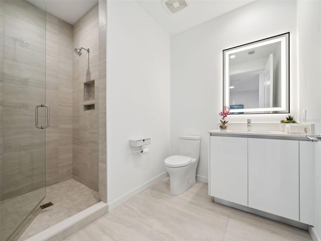 bathroom with vanity, toilet, and walk in shower