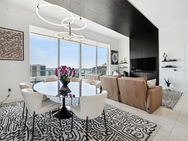 dining area with a notable chandelier and light tile patterned floors