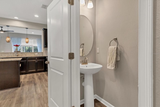 bathroom featuring hardwood / wood-style floors and sink