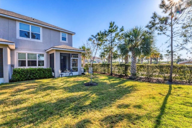 view of yard featuring a sunroom