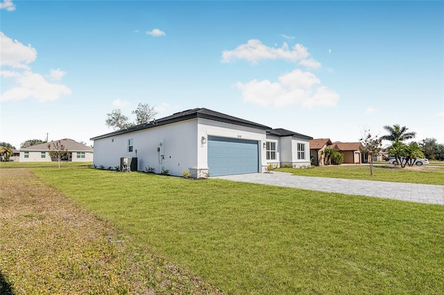 ranch-style house with a garage and a front lawn