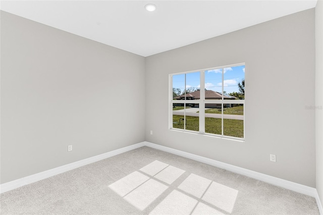 spare room featuring carpet flooring