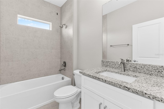 full bathroom featuring vanity, toilet, and tiled shower / bath