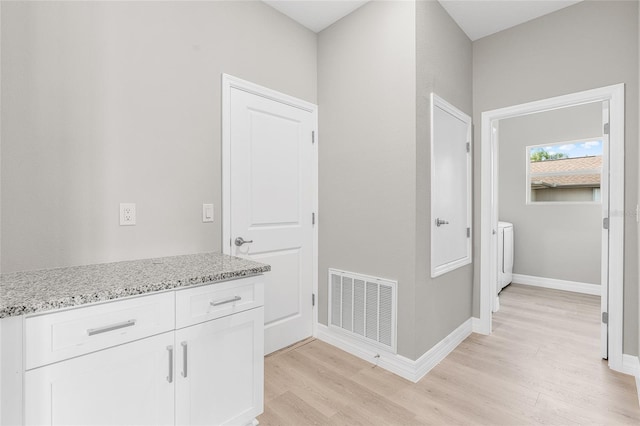 hallway featuring light hardwood / wood-style flooring